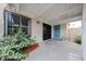 Covered patio features security door, block fence, and convenient laundry access at 6533 N 7Th Ave # 18, Phoenix, AZ 85013