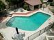 Community pool with lounge chairs, tables and chairs, and covered seating at 6533 N 7Th Ave # 18, Phoenix, AZ 85013