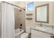 Bright bathroom with tiled shower/tub and vanity with marble countertop at 654 E County Down Dr, Chandler, AZ 85249