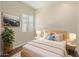 Well-lit bedroom features a comfortable bed, stylish decor, and ample natural light for a relaxing ambiance at 654 E County Down Dr, Chandler, AZ 85249