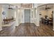 Open concept foyer with hardwood floors and arched entryways leading to multiple rooms at 654 E County Down Dr, Chandler, AZ 85249