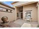 Inviting front porch featuring a cozy bench, decorative water feature and neutral color palette at 654 E County Down Dr, Chandler, AZ 85249