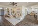 Bright and airy living room leading into a kitchen with modern design and hardwood floors at 654 E County Down Dr, Chandler, AZ 85249