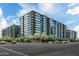 Modern condos feature walls of glass, concrete accents, and outdoor patios with plants at 7180 E Kierland Blvd # 814, Scottsdale, AZ 85254