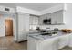 Modern kitchen featuring gray cabinets, stainless steel appliances, and granite countertops at 7180 E Kierland Blvd # 814, Scottsdale, AZ 85254