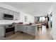 Contemporary kitchen featuring granite countertops, stainless steel appliances, and wood floors at 7180 E Kierland Blvd # 814, Scottsdale, AZ 85254