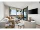 Bright living room with modern furniture and a stunning view from large window, creating a relaxing atmosphere at 7180 E Kierland Blvd # 814, Scottsdale, AZ 85254