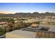Rooftop patio with fire pit and city views, surrounded by well-manicured garden beds at 7180 E Kierland Blvd # 814, Scottsdale, AZ 85254