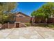 Backyard featuring stone patio and a built-in outdoor grill at 7456 W Irma Ln, Glendale, AZ 85308