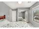 Comfortable bedroom with plush carpeting, a mirrored closet and a view to the outside at 7456 W Irma Ln, Glendale, AZ 85308