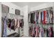 Walk-in closet with organized storage, shelves, and hanging rods at 7456 W Irma Ln, Glendale, AZ 85308