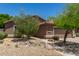 Inviting single-story home with desert landscaping and a spacious driveway at 7456 W Irma Ln, Glendale, AZ 85308