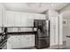 Modern kitchen featuring white cabinets, stainless steel appliances, and granite countertops at 7456 W Irma Ln, Glendale, AZ 85308