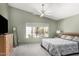 This main bedroom features neutral colors and a view to the outside at 7456 W Irma Ln, Glendale, AZ 85308