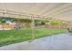 Expansive backyard featuring a covered patio, lush lawn, mature trees, and recreational amenities at 7607 N 17Th Ave, Phoenix, AZ 85021