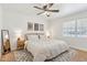 Warm and inviting bedroom with soft lighting, neutral tones, hardwood floors and decorative artwork at 7607 N 17Th Ave, Phoenix, AZ 85021