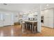 Charming kitchen with an island, seating, ample lighting, white cabinetry, and stainless steel appliances at 7607 N 17Th Ave, Phoenix, AZ 85021