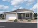 Charming single-story home with a two-car garage and desert landscaping at 7709 W Saddlehorn Rd, Peoria, AZ 85383