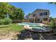 Inviting backyard oasis with a sparkling pool, spa, and lush greenery at 822 E Ross Ave, Phoenix, AZ 85024