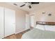 Bedroom with ceiling fan, closet, wood flooring, and a comfortable queen bed at 822 E Ross Ave, Phoenix, AZ 85024