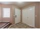 Inviting entryway featuring tile flooring, white doors and staircase, bathed in natural light at 822 E Ross Ave, Phoenix, AZ 85024