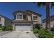 Charming two-story home featuring a well-maintained front yard and attached two-car garage at 822 E Ross Ave, Phoenix, AZ 85024