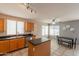 Bright kitchen features stainless steel appliances, a center island, tile floors, and natural light at 822 E Ross Ave, Phoenix, AZ 85024