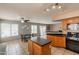 Bright open kitchen featuring breakfast bar, stainless appliances, and seamless flow to dining area at 822 E Ross Ave, Phoenix, AZ 85024