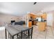 Open concept kitchen with stainless steel appliances flows into the dining and living area at 822 E Ross Ave, Phoenix, AZ 85024