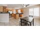 Spacious kitchen features stainless steel appliances, a center island, and breakfast table at 822 E Ross Ave, Phoenix, AZ 85024