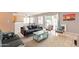 Bright living room offering sliding doors to the backyard, comfortable seating, and an open layout at 822 E Ross Ave, Phoenix, AZ 85024