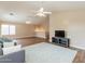 Open concept living room with wood floors and ceiling fans at 822 E Ross Ave, Phoenix, AZ 85024