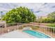 Backyard view of pool and mature landscaping from a balcony at 822 E Ross Ave, Phoenix, AZ 85024