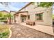 Spacious backyard with a covered patio, dining table, and views of the surrounding landscape at 9034 W Eagle Talon Dr, Peoria, AZ 85383