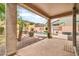 Stunning backyard featuring a sparkling pool, lush landscaping, and a cozy seating area at 9034 W Eagle Talon Dr, Peoria, AZ 85383