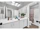 Bathroom featuring double sink vanity and a decorative mirror at 9034 W Eagle Talon Dr, Peoria, AZ 85383