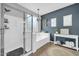 Spacious bathroom with a large shower, soaking tub, and decorative fixtures at 9034 W Eagle Talon Dr, Peoria, AZ 85383