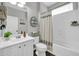 Traditional bathroom features a tub-shower combo and white vanity at 9034 W Eagle Talon Dr, Peoria, AZ 85383