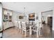 Open dining room with tile floors, an elegant chandelier, and large dining table at 9034 W Eagle Talon Dr, Peoria, AZ 85383