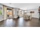 Inviting dining room featuring a tile floor, a chandelier, and access to the backyard patio at 9034 W Eagle Talon Dr, Peoria, AZ 85383