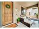 Welcoming front porch with stylish seating and a charming entrance at 9034 W Eagle Talon Dr, Peoria, AZ 85383