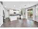 Bright kitchen with white cabinetry, stainless appliances, and a sliding glass door at 9034 W Eagle Talon Dr, Peoria, AZ 85383