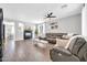 Spacious living room with tile flooring, a fireplace, and ample natural light at 9034 W Eagle Talon Dr, Peoria, AZ 85383