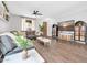 Cozy living room with tile floors, comfortable seating, and views of the backyard at 9034 W Eagle Talon Dr, Peoria, AZ 85383