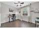 Home office features a built-in desk area, modern decor, and ample sunlight at 9034 W Eagle Talon Dr, Peoria, AZ 85383