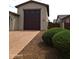 Spacious three-car garage with clean brick driveway at 9187 W Parkside Ln, Peoria, AZ 85383
