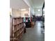 A garage with a recreational vehicle, storage shelves, and epoxy floors at 9187 W Parkside Ln, Peoria, AZ 85383