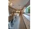 Beautiful kitchen flowing into dining area, featuring sleek countertops, ample cabinet space, and tile floors at 9187 W Parkside Ln, Peoria, AZ 85383