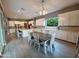Open-concept kitchen with dining area featuring tile flooring, large island, and modern finishes at 9187 W Parkside Ln, Peoria, AZ 85383