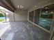Covered patio with view to pool and grassy area with modern patio furniture at 9187 W Parkside Ln, Peoria, AZ 85383